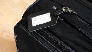 black leather label on a black suitcase